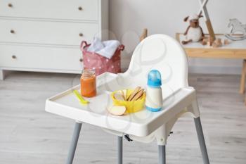 Baby highchair with food in room�
