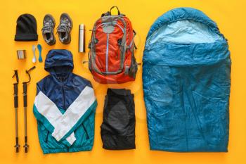 Equipment for hiking on color background�