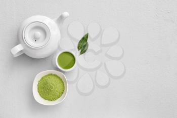 Composition with powdered matcha tea on light background�