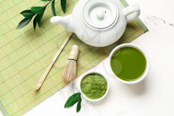 Composition with matcha tea on light background�