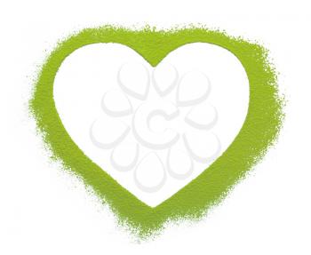 Powdered matcha green tea in heart shape on white background�