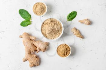 Composition with ginger powder on light background�
