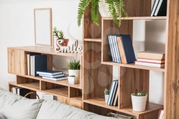 Shelf unit with books in interior of room�