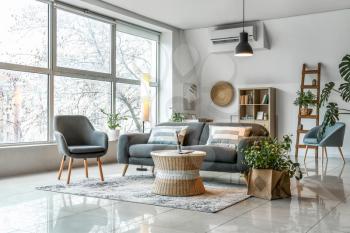 Interior of stylish living room with glowing lamps�