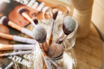 Set of makeup brushes in holder, closeup�