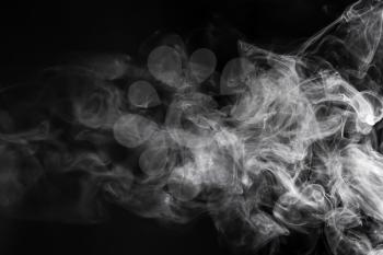 White smoke on dark background, closeup�