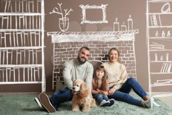 Happy family dreaming about moving into new house�