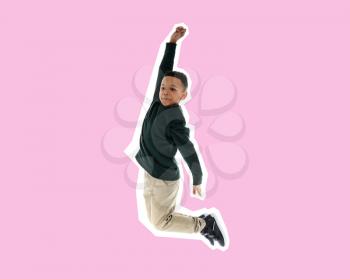 Jumping African-American boy on color background�