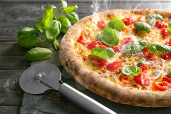 Delicious hot pizza on table�