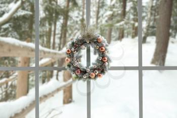 Beautiful Christmas wreath hanging on window�