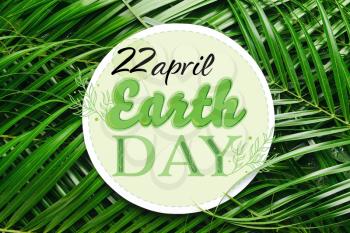 Card with green palm leaves. Earth Day celebration�