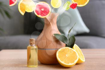 Citrus oil diffuser on table in room�
