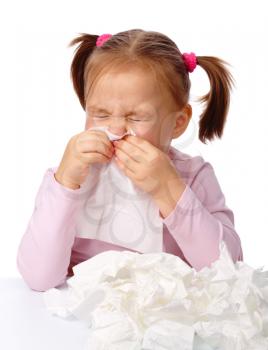 Royalty Free Photo of a Little Girl Blowing Her Nose