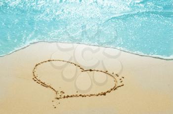 heart on the sand seashore - love and  romantic concept 
