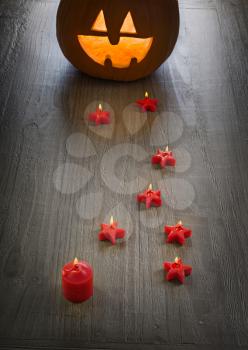 pumpkin halloween Jack O'Lantern on old wooden background