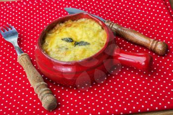 julienne with mushrooms, cream and cheese on red polka dot tablecloth