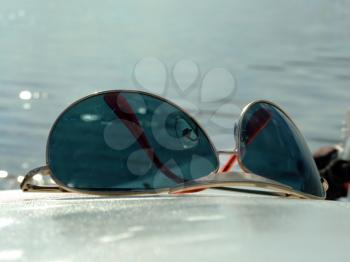 Royalty Free Photo of Sunglasses With Water in the Background