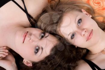 Royalty Free Photo of Two Women Lying on a Pillow