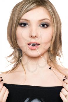 Royalty Free Photo of a Woman With a Bead in Her Mouth