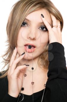Royalty Free Photo of a Woman Holding a Bead in Her Mouth