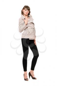 Royalty Free Photo of a Woman in a Jacket and Black Leggings