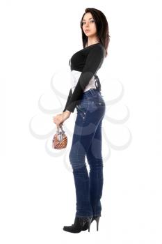 Royalty Free Photo of a Young Woman in Jeans Holding a Small Handbag