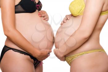 Royalty Free Photo of Two Pregnant Women's Bellies