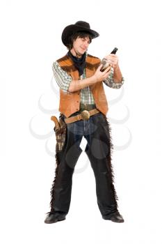 Royalty Free Photo of a Cowboy With a Whiskey Bottle