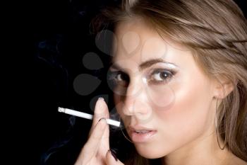 Royalty Free Photo of a Woman Smoking