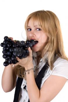Royalty Free Photo of a Girl Eating Grapes