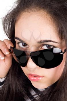 Royalty Free Photo of a Girl Looking Over Her Sunglasses