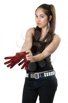 Royalty Free Photo of a Young Girl Pulling on Gloves
