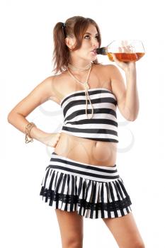 Royalty Free Photo of a Woman Drinking From a Bottle of Whiskey