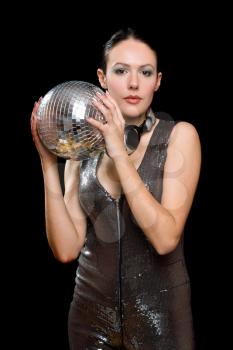 Portrait of nice young woman with a mirror ball in her hands. Isolated on black