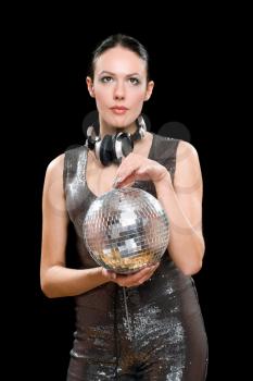 Portrait of beautiful woman with a mirror ball in her hands. Isolated on black