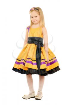 Beautiful little girl in a yellow dress. Isolated