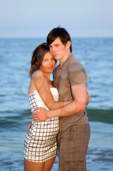 Closeup portrait of a happy young couple on the beach