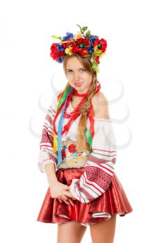 Portrait of a smiling young woman in the Ukrainian national clothes. Isolated