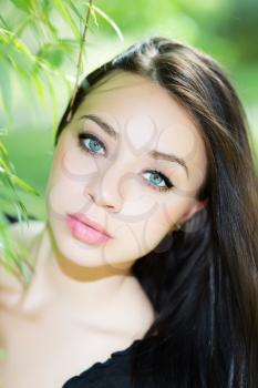 Portrait of beautiful young caucasian woman posing outdoors