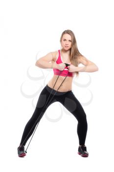 Sporty woman doing exercises with expander. Isolated on white