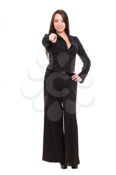 Beautiful young brunette wearing black business suit. Isolated on white