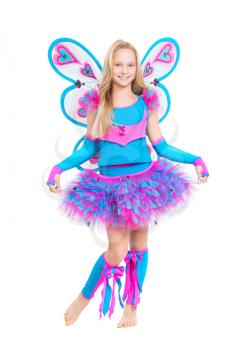 Pretty smiling girl wearing like a butterfly showing her costume. Isolated on white