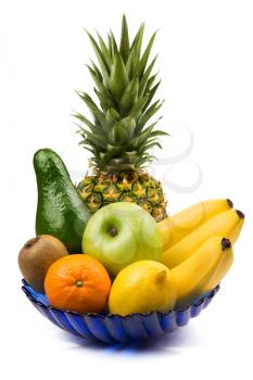 Close-up of juicy fruits in blue vase on white background