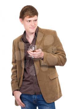 Handsome man posing with a glass of whiskey. Isolated on white