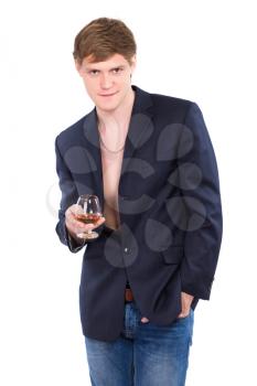 Young man posing with a glass of whiskey. Isolated