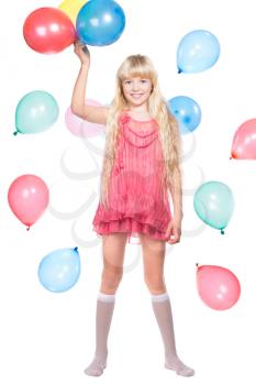 Cheerful little girl posing with balloons. Isolated on white