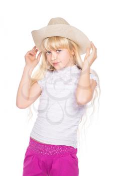 Portrait of nice little blond girl in stetson. Isolated on white