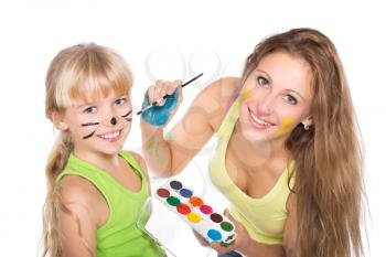 Portrait of two playful girls with paints. Isolated on white