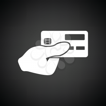 Hand holding credit card icon. Black background with white. Vector illustration.