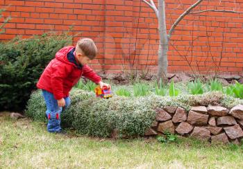 Royalty Free Photo of a Little Boy Playing Outside